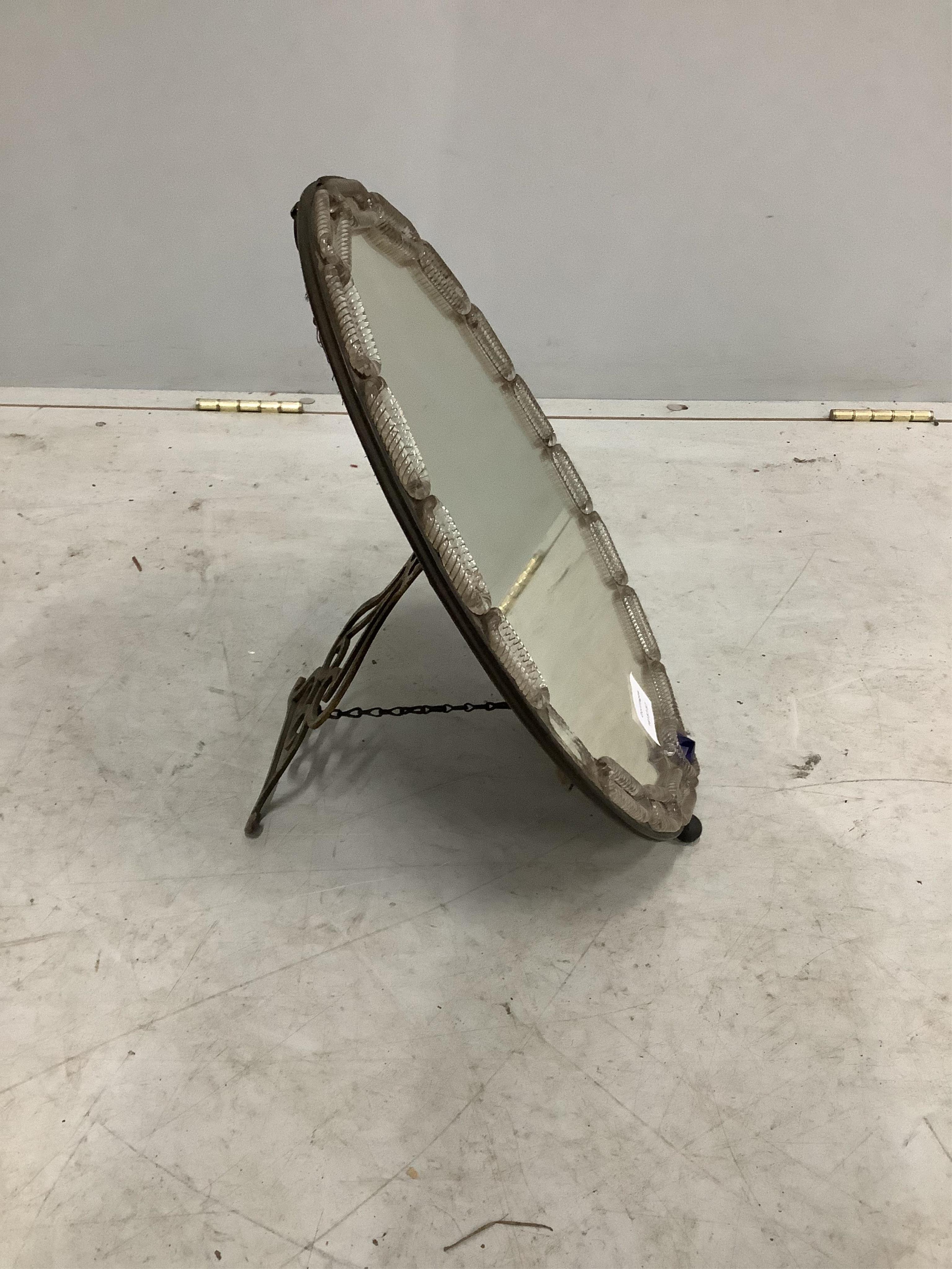 A 19th century Venetian oval strut dressing table mirror, width 32cm, height 42cm. Condition - fair but lacks one oval glass boss to left side